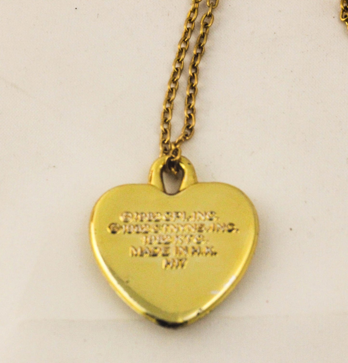 Vintage Doll with Red Dress and Heart-Shaped 'Annie'