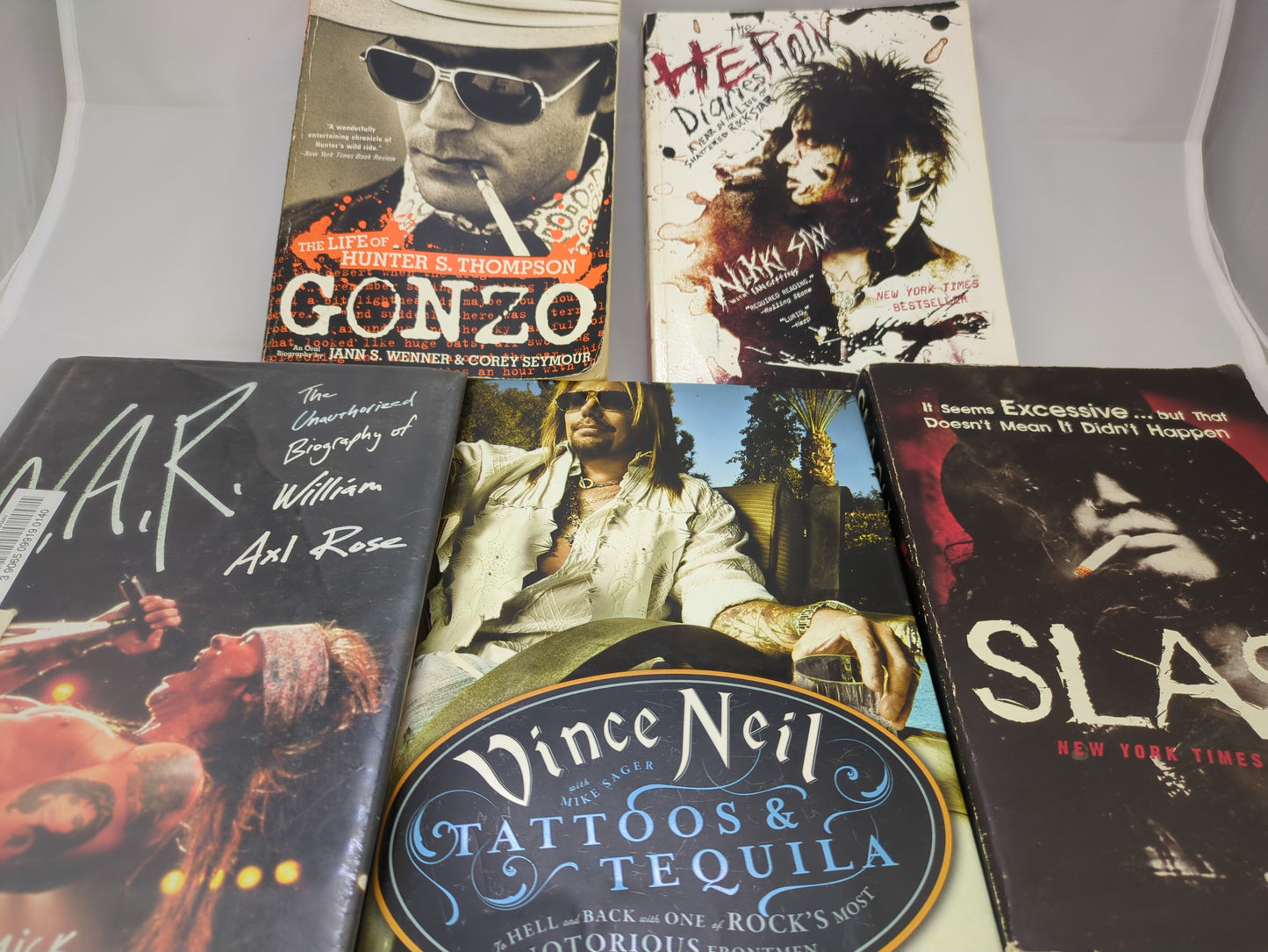 Collection of music-themed books on a white surface