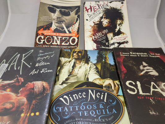 Collection of music-themed books on a white surface